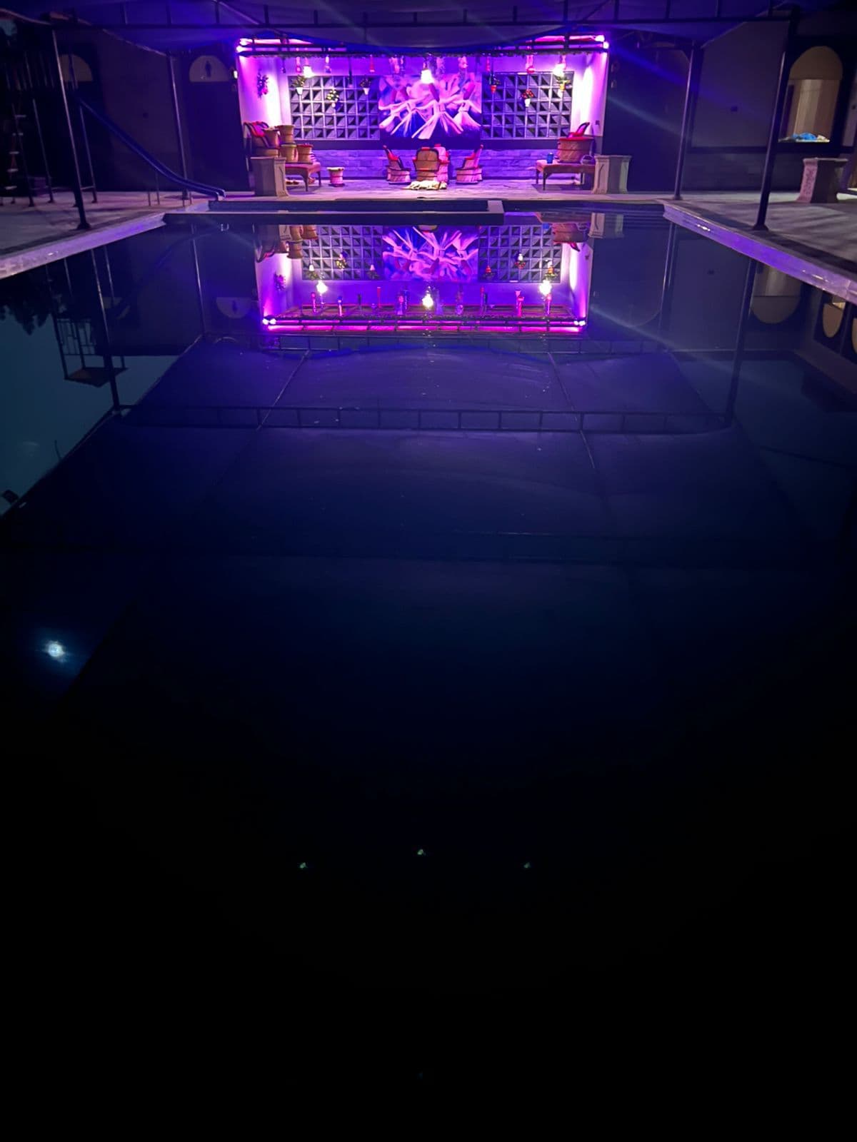 Black Gold Farmhouse luxury pool at night