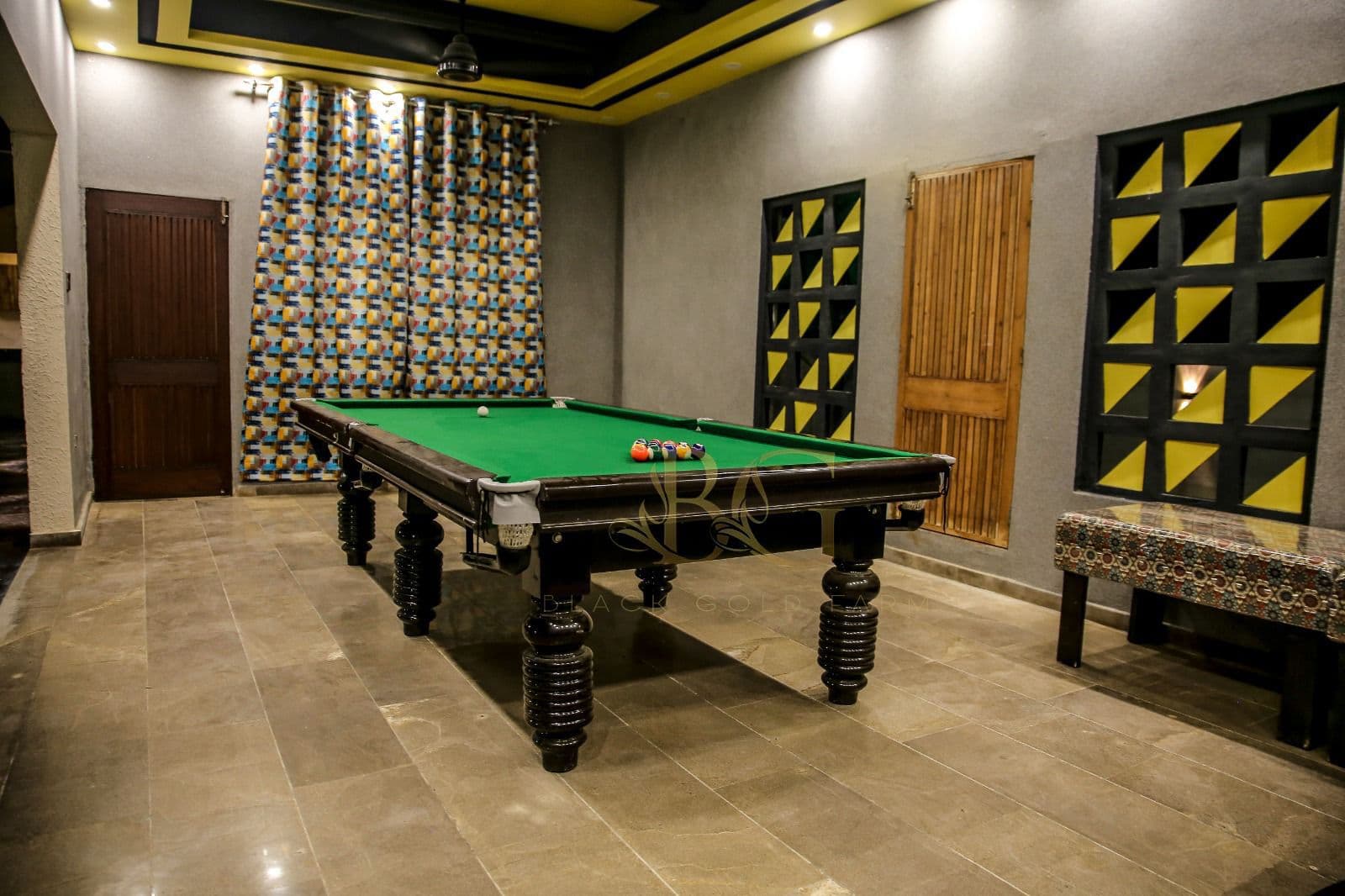 Air-conditioned indoor games room with snooker table